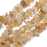 four citrine chip bead strands over white surface. 
