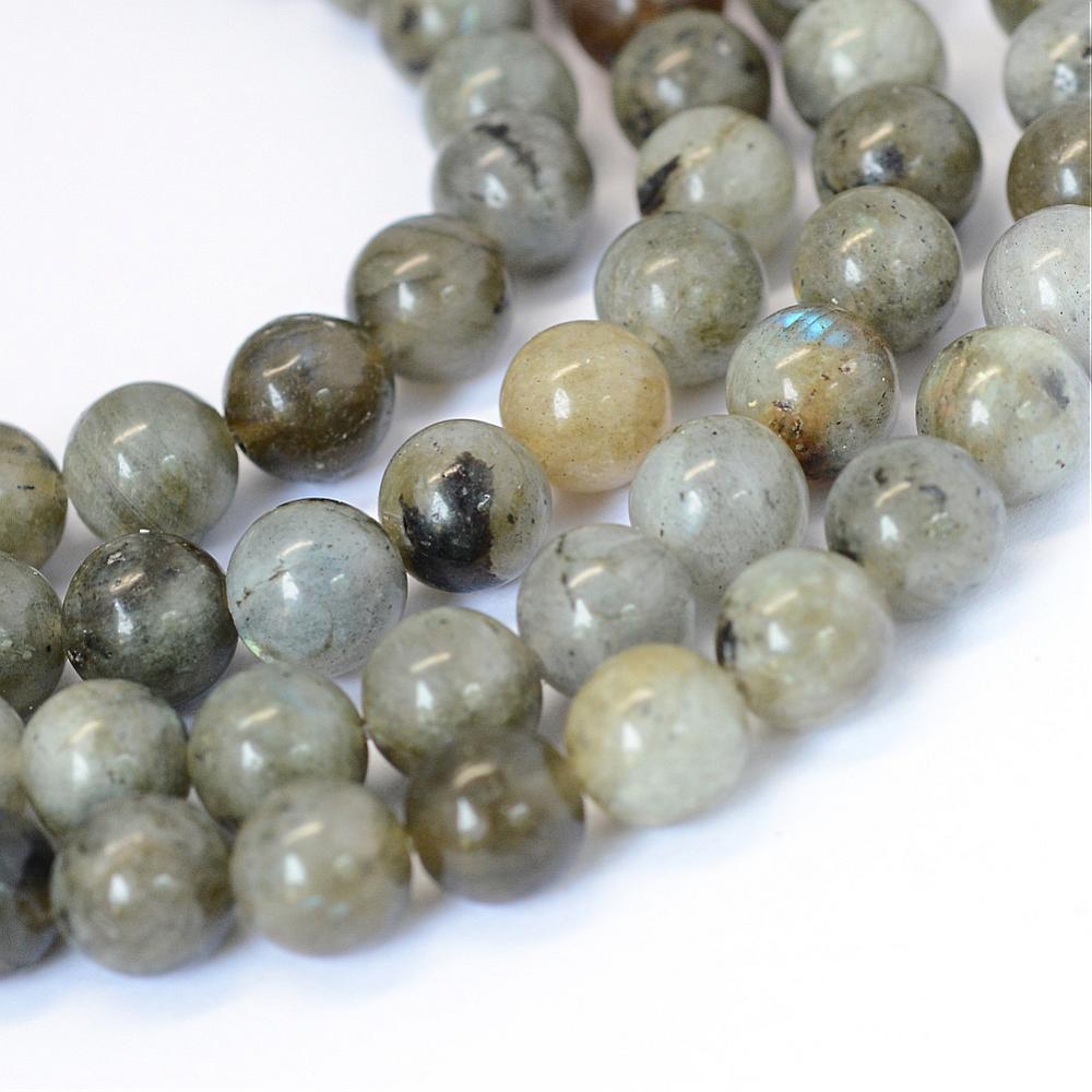four strands of smooth round grade b labradorite stone beads over white background. 