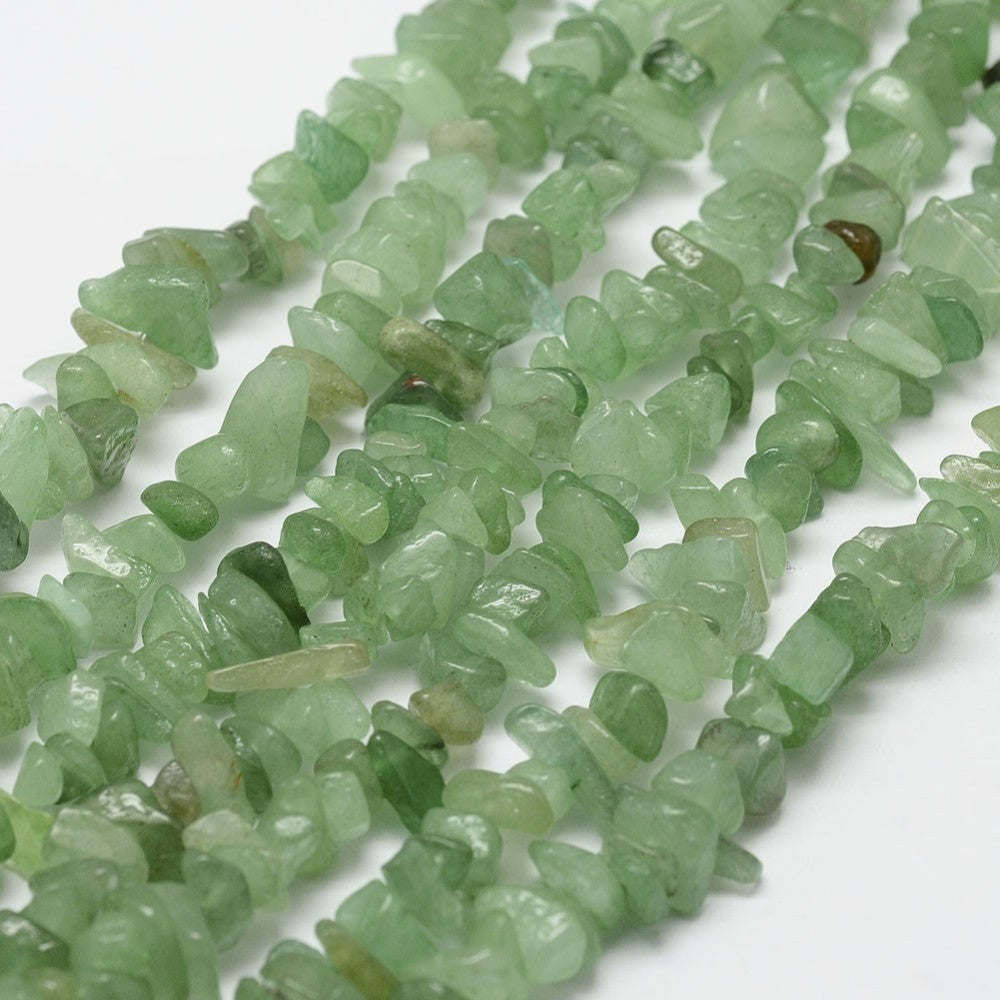 six green aventurine chip bead strands over white background. 