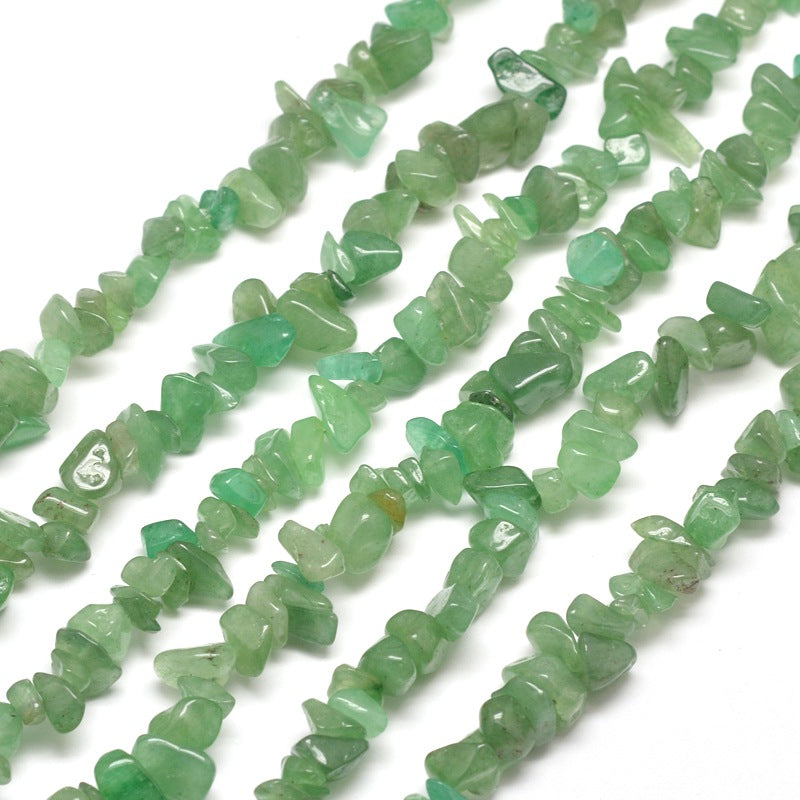 six green aventurine chip bead strands over white background. 
