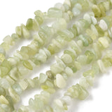 six strands of new jade chip bead strands over white surface. 