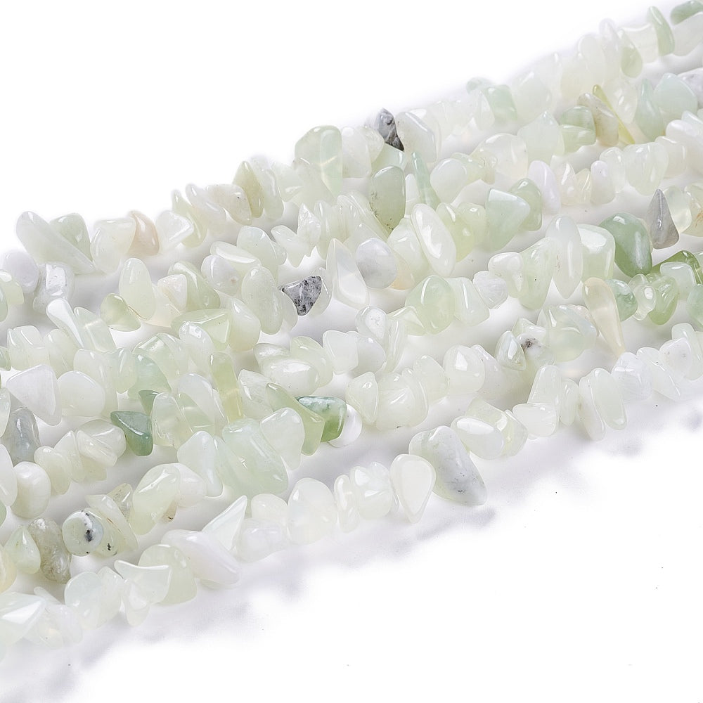 six strands of new jade chip bead strands over white surface. 