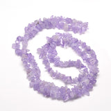 lavender amethyst chip bead strand in swirl design over white background. 