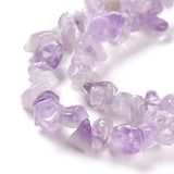 zoomed in sections of lavender amethyst chip bead strands over white background. 