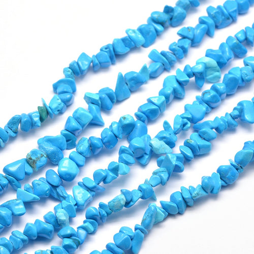 six dyed light sky blue synthetic turquoise chip bead strands over white surface. 