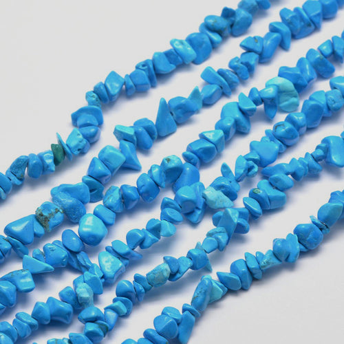 six dyed light sky blue synthetic turquoise chip bead strands over white surface. 
