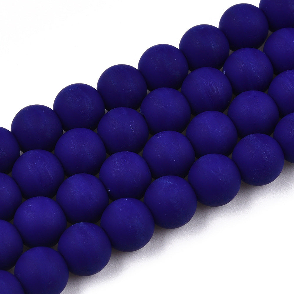four frosted opaque navy blue round bead strands over white background. 