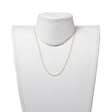 golden ball chain necklace on white neck form with white background. 