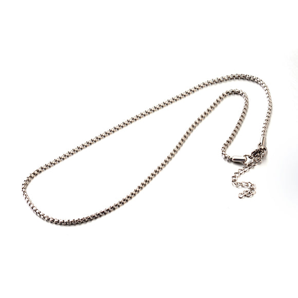 silver tone Venetian box chain with lobster claw clasp and extender chain over white background. 
