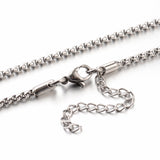 zoomed in section of silver tone Venetian box chain with lobster claw clasp and extender chain over white background. 