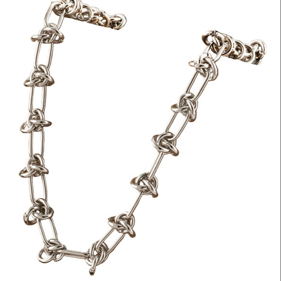 silver tone knotted paperclip link necklace over white background. 