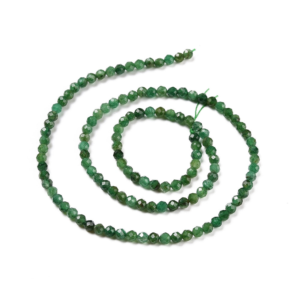 strand of dark green faceted round Fuchsite beads in a swirl design over white background. 