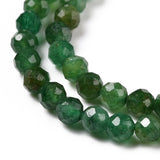 zoomed in sections of dark green faceted round Fuchsite beads over white background. 