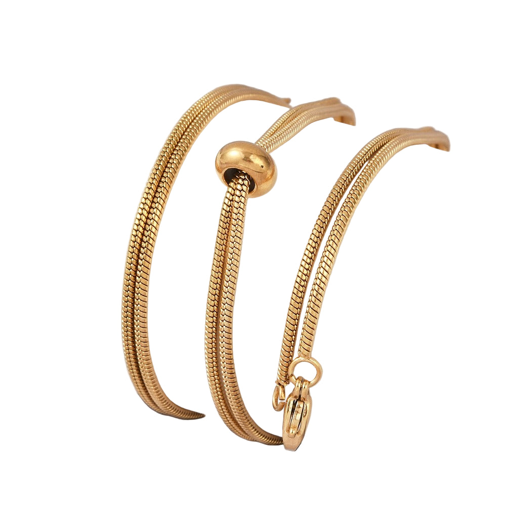 golden snake chain bolo necklace with lobster slider stopper bead and lobster claw clasp on white background. 