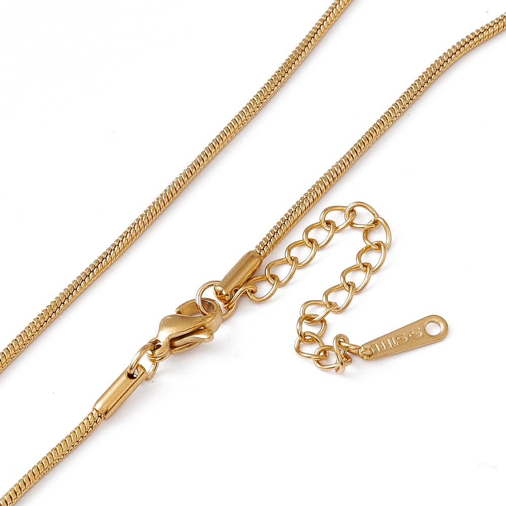 zoomed in sections of golden snake chain necklace with lobster claw clasp and extender chain on white background. 