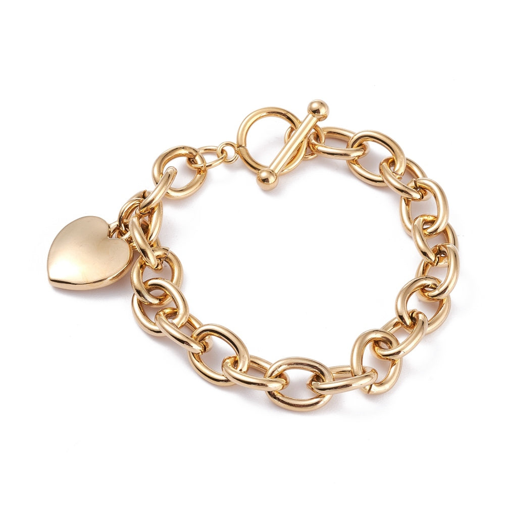 golden charm bracelet with toggle clasp and heart charm on white background. 