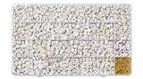 twenty-eight compartment bead box filled with gold lettered round flat white beads and gold spacer beads over white background. 