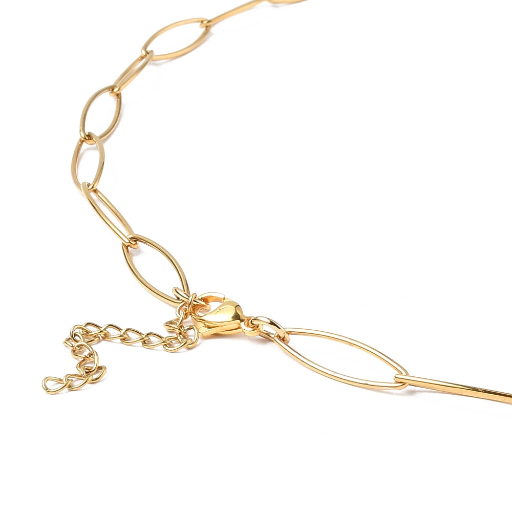 zoomed in section of golden marquise paperclip chain necklace with lobster claw clasp and extender chain over white background. 