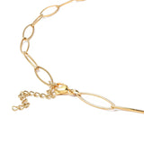 zoomed in section of golden marquise paperclip chain necklace with lobster claw clasp and extender chain on white background. 