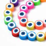 zoomed in sections of multicolor polymer clay round eye bead strands over white background. 