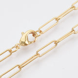zoomed in sections of golden medium round oval paperclip chain necklace with lobster claw clasp on white background. 