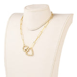 plated brass paperclip link chain with swivel heart clasp displayed on a white neck form with a white background. 