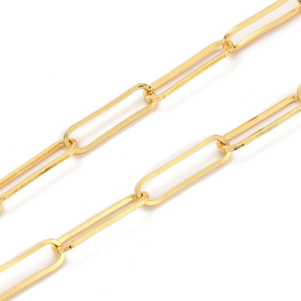 zoomed in section of plated brass paperclip link chains with swivel heart clasp on white background. 