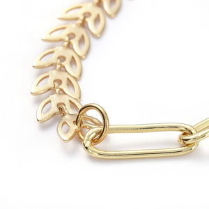golden mixed chain necklace with both cob leaf and paperclip links and toggle clasp on white background. 
