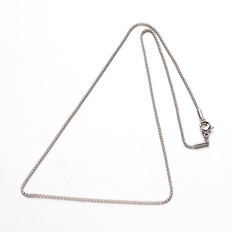silver tone box chain necklace with lobster claw clasp over white background. 