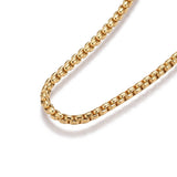 zoomed in portion of golden Venetian box chain Bolo necklace with slider bead and 2 jump rings on white background. 