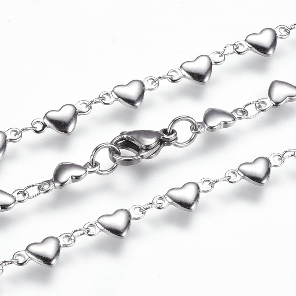 zoomed in sections of stainless steel flat heart link necklace with lobster claw clasp on white background. 