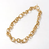 golden Rolo chain necklace with toggle clasp on a white background. 