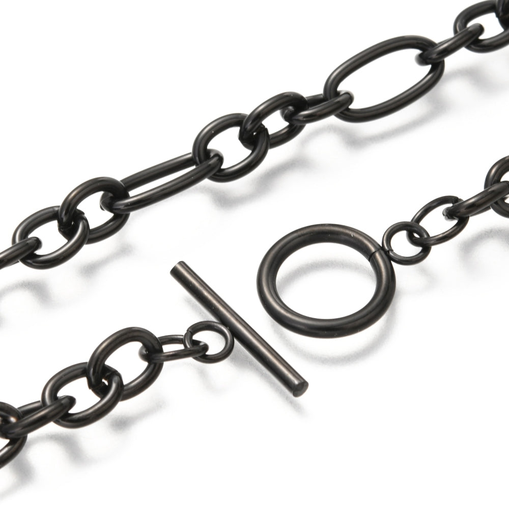 zoomed in section of black Figaro chain necklace with toggle clasp on a white background.