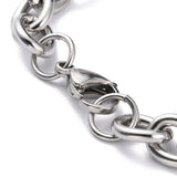 zoomed in lobster claw clasp of stainless steel heavy Figaro bracelet on white background.
