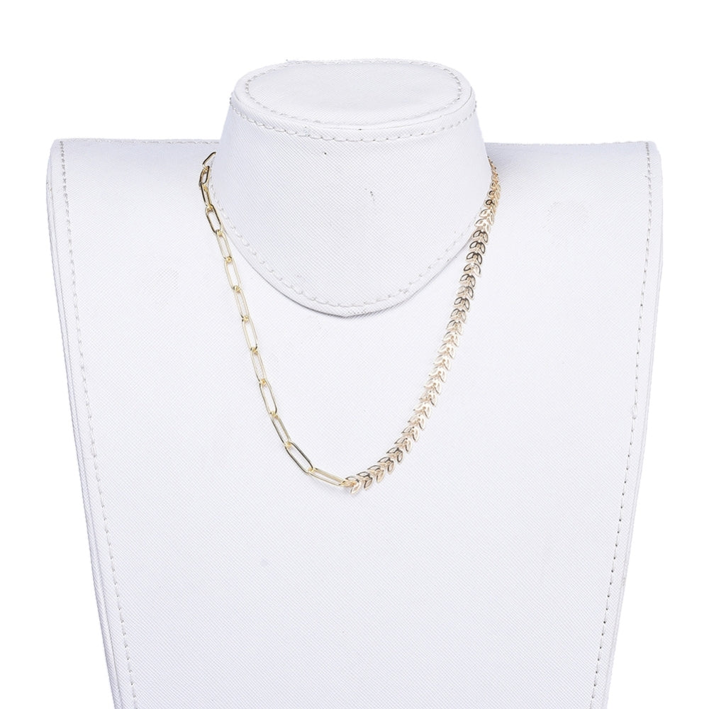 golden mixed chain necklace with both cob leaf and paperclip links and toggle clasp on a white neck form with white background. 