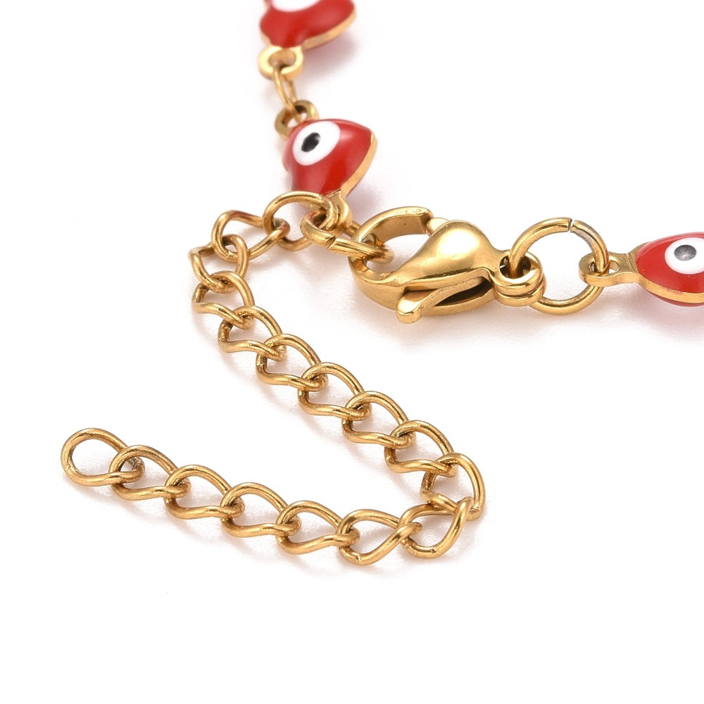 zoomed in golden lobster claw clasp and extender chain on golden and red enamel, heart shaped evil eye bracelet on a white background.