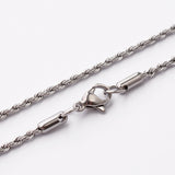 zoomed in sections of stainless steel rope chain with lobster claw clasp on white background. 