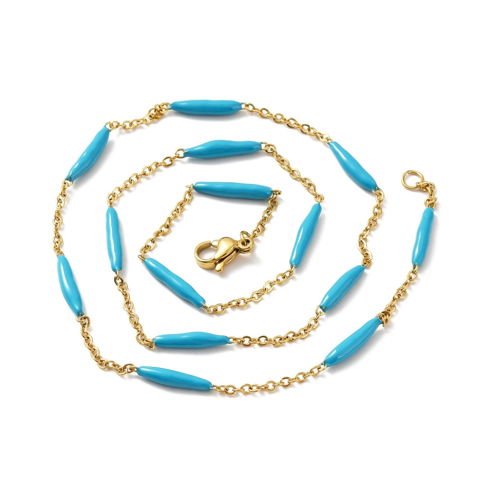 golden curb chain and blue enamel bar link necklace with lobster claw clasp on white background. 