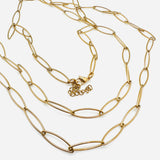 golden marquise paperclip chain necklace with lobster claw clasp and extender chain on white background. 