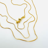 gold plated brass, adjustable box chain with lobster claw clasp on a white background.