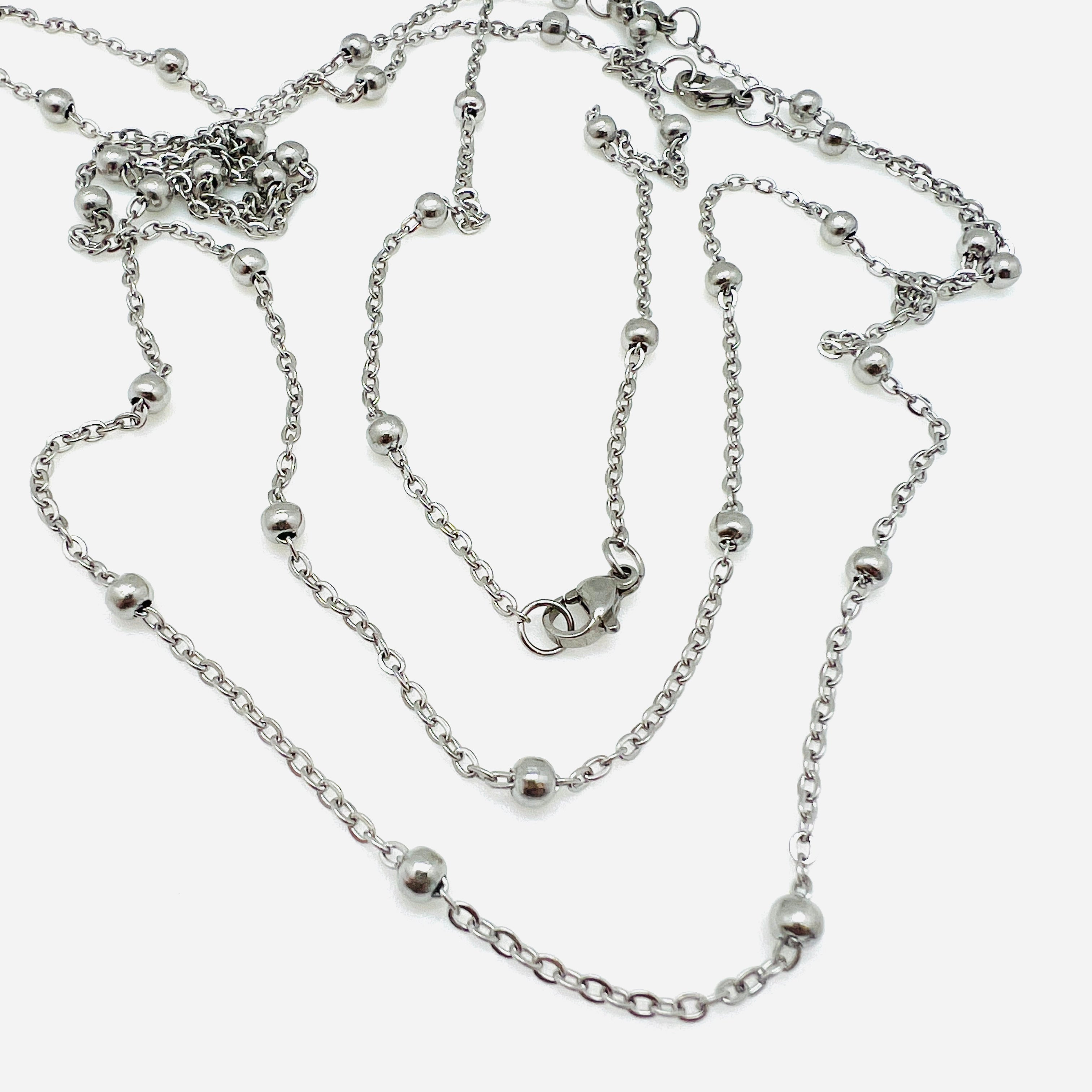 stainless steel large bead satellite chain necklace with lobster claw clasp on white background. 
