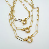3 golden paperclip chain necklaces with large spring ring clasp on white background. 