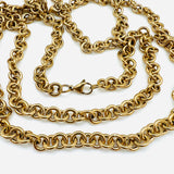 golden large Rolo chain necklace with lobster claw clasp on white background. 