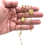 2 golden rosary bracelets displaying both the front and back of the oval medal on a hand on a white background.