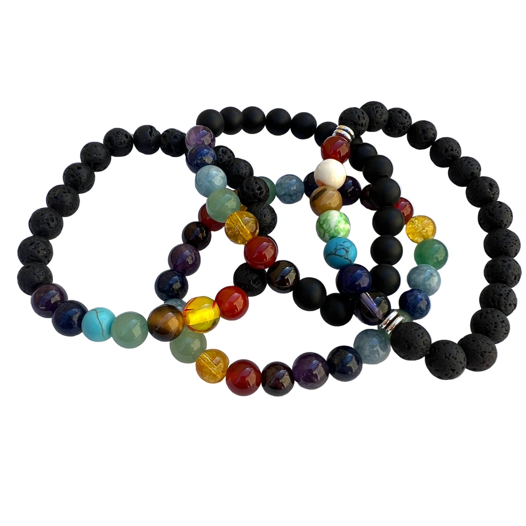 four different versions of stretch chakra bracelets over white background. 