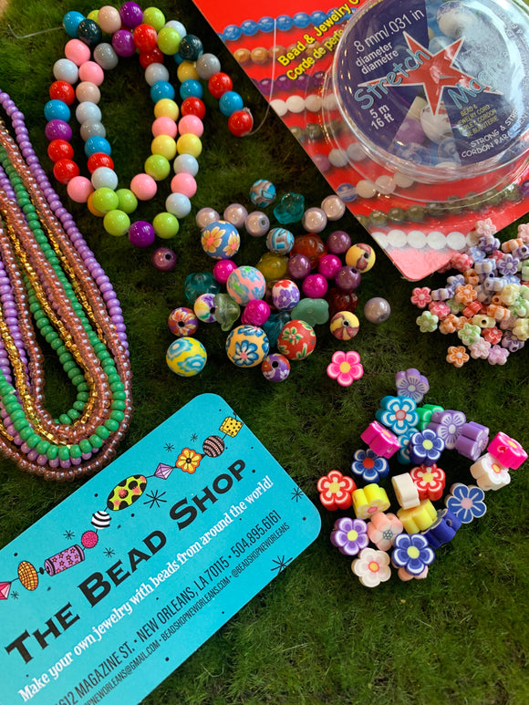 Bead kit full of jewelry making supplies perfect to make beaded bracelets. Kit includes glass beads, seed beads, heishi beads and charms