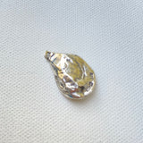 This shows the reverse side of a small sterling oyster pendant