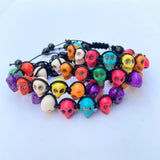 Dyed multi-color stone skull beads with black nylon cord as an adjustable bracelet