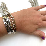 stainless steel chain bracelet on a woman's wrist to show scale on a white background