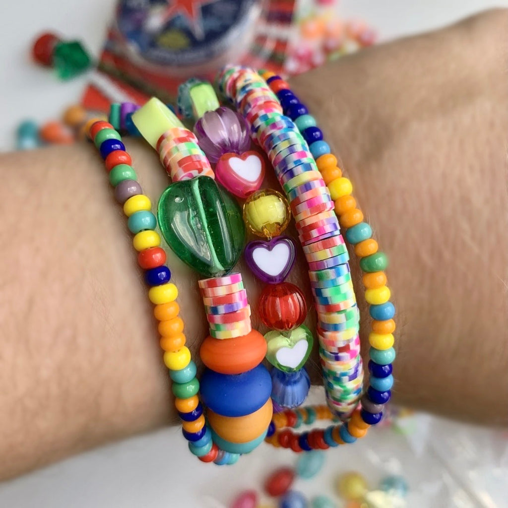 Bead kit full of jewelry making supplies perfect to make beaded bracelets. Kit includes glass beads, seed beads, heishi beads and charms